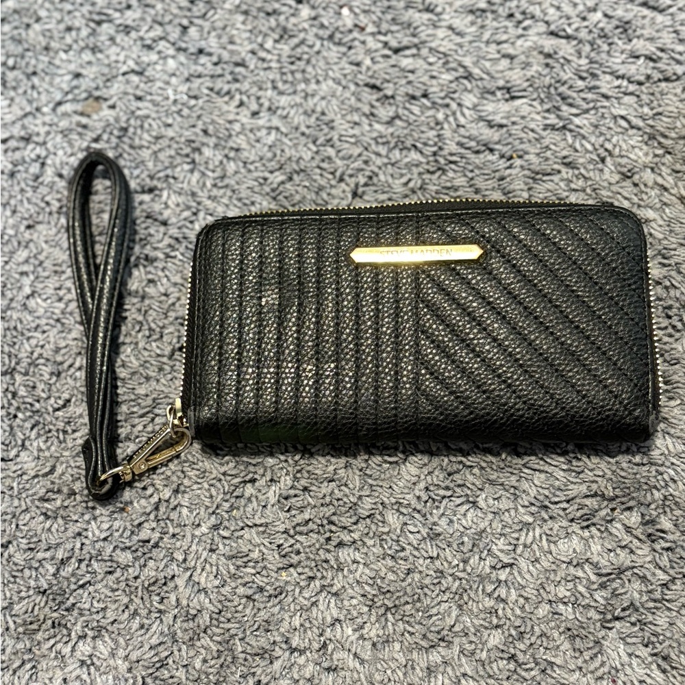 Lightly used black with gold interior Steve Madden wristlet wallet